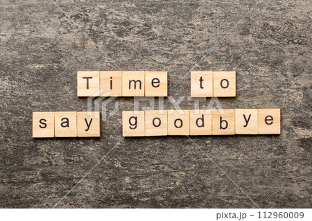 Time to say goodbye word written on wood block. Time to say goodbye text on table for your desing, concept 112960009