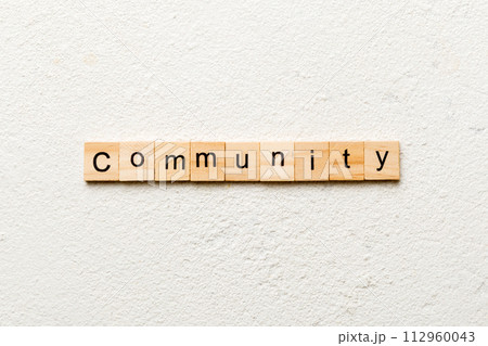 Community word written on wood block. Community text on table, concept Community word written on wood block. Community text on table, concept 112960043