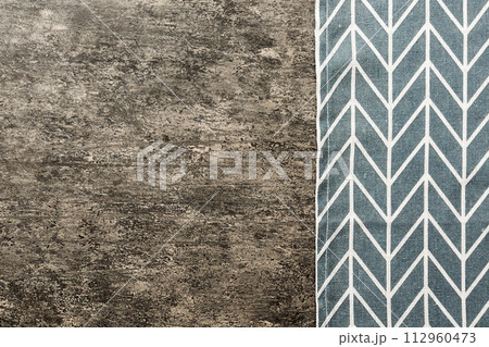 top view with blue kitchen napkin isolated on table background. Folded cloth for mockup with copy space, Flat lay. Minimal style 112960473