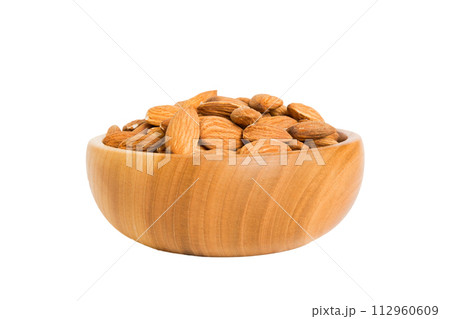 Roasted almonds in bowl isolated on white background. almonds is snack or raw of cook. Healthy food concept 112960609