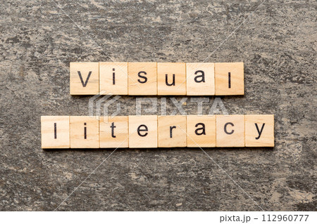 visual literacy word written on wood block. visual literacy text on cement table for your desing, concept 112960777