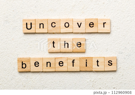 uncover the benefits word written on wood block. uncover the benefits text on table, concept uncover the benefits word written on wood block. uncover the benefits text on table, concept 112960908