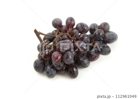 Bunch of organic black grapes isolated on white background. Bunch of organic black grapes isolated on white background. 112961049