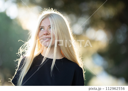 Blonde Woman With Long Hair Looking Up 112962556