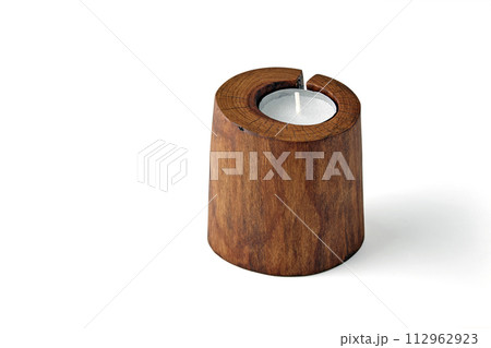 Cracked sawn wood candle holder and pillar candles isolated on a white background 112962923