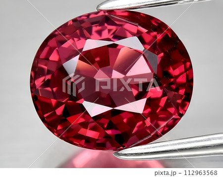 natural red rhodolite garnet gemstone on the background 112963568