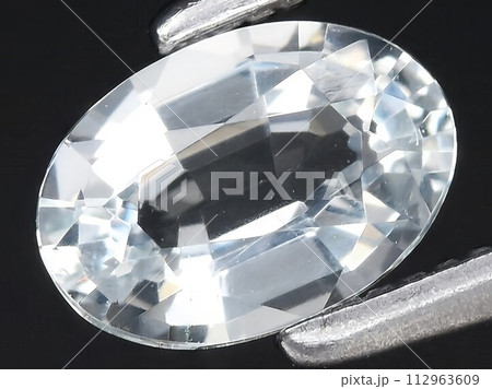 natural blue aquamarine gemstone on the background 112963609
