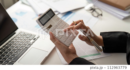 Documents, Business woman and accountant reading report for information, financial data or analysis. Paperwork, auditor check, review and bookkeeping, Calculate finance and tax in office 112963779