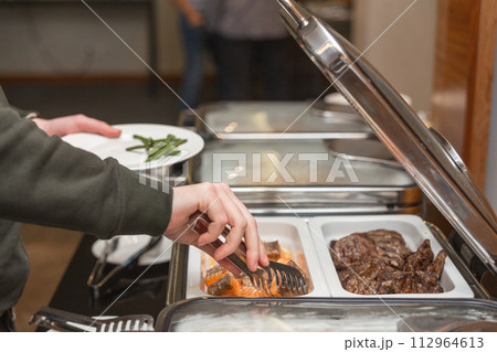 The participants of the business seminar choose food The participants of the business seminar choose food 112964613