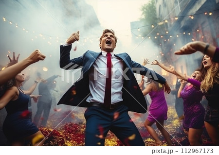 A cool man in sunglasses and tie gestures to crowd 112967173