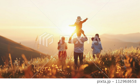 Happy family walk and play fun in park nature at sunset together. Happy family walk and play fun in park nature at sunset together. 112968658