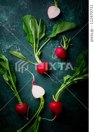 Fresh organic radish on green background 112970731