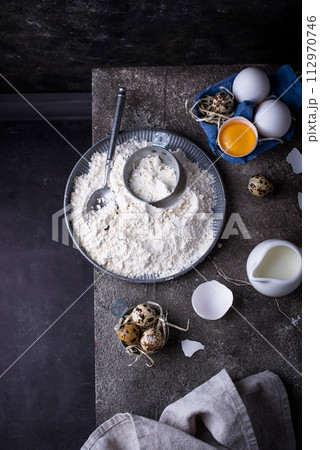 Baking ingredients with flour and eggs Baking ingredients with flour and eggs 112970746