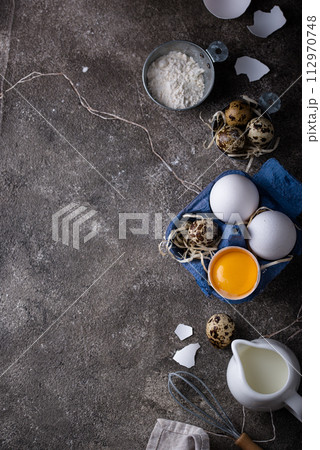 Baking ingredients with flour and eggs 112970748