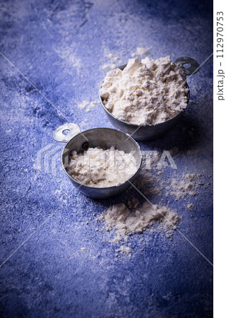 Wheat flour on dark. Baking background Wheat flour on dark. Baking background 112970753