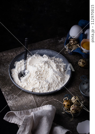 Baking ingredients with flour and eggs Baking ingredients with flour and eggs 112970815