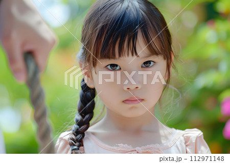 AI-generated content. Little Girl With a Braid in Her Hair 112971148