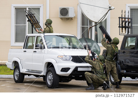 The Russian military is attacking an enemy unmanned aerial vehicle in the sky. The Russian military is attacking an enemy unmanned aerial vehicle in the sky. 112971527