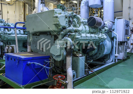 Marine engine. Diesel generator. Engine room interior. 112971922