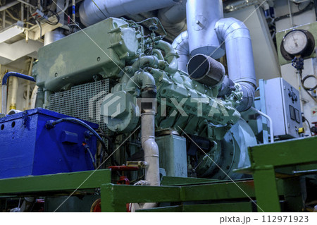 Marine engine. Diesel generator. Engine room interior. 112971923
