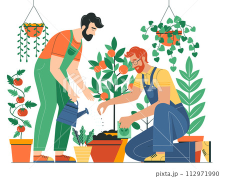 Gay Couple Planting and Watering Vegetable Plants Gay Couple Planting and Watering Vegetable Plants 112971990