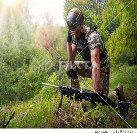 A soldier in the grass pray God A soldier in the grass pray God 112972418