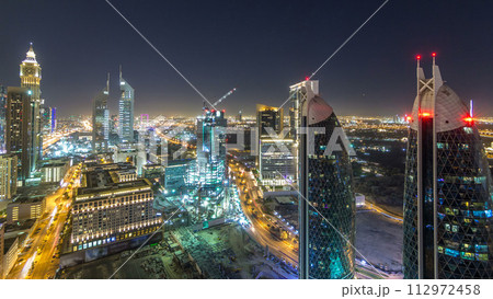 Skyline view of the buildings of Sheikh Zayed Road and DIFC night timelapse in Dubai, UAE. Skyline view of the buildings of Sheikh Zayed Road and DIFC night timelapse in Dubai, UAE. 112972458