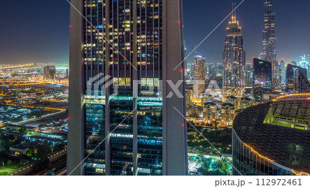 Dubai downtown skyline night timelapse with tallest building and Sheikh Zayed road traffic, UAE 112972461