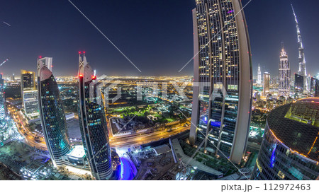 Skyline view of the buildings of Sheikh Zayed Road and DIFC night timelapse in Dubai, UAE. 112972463