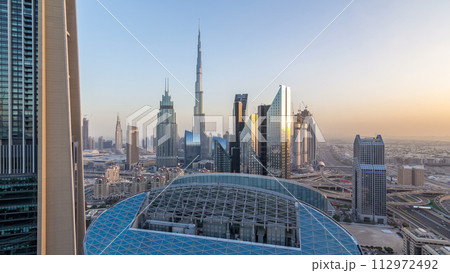 Dubai downtown skyline day to night timelapse with tallest building and Sheikh Zayed road traffic, UAE Dubai downtown skyline day to night timelapse with tallest building and Sheikh Zayed road traffic, UAE 112972492