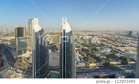 Skyline view of the buildings of Sheikh Zayed Road and DIFC timelapse in Dubai, UAE. Skyline view of the buildings of Sheikh Zayed Road and DIFC timelapse in Dubai, UAE. 112972495
