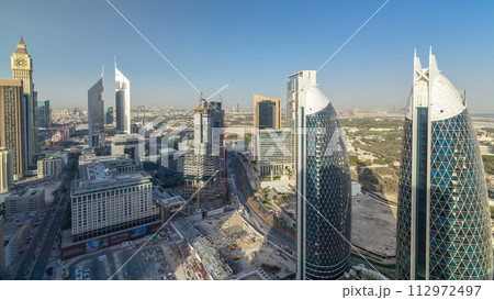 Skyline view of the buildings of Sheikh Zayed Road and DIFC timelapse in Dubai, UAE. Skyline view of the buildings of Sheikh Zayed Road and DIFC timelapse in Dubai, UAE. 112972497