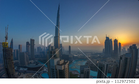 Foggy morning sunrise in downtown of Dubai timelapse. 112972502