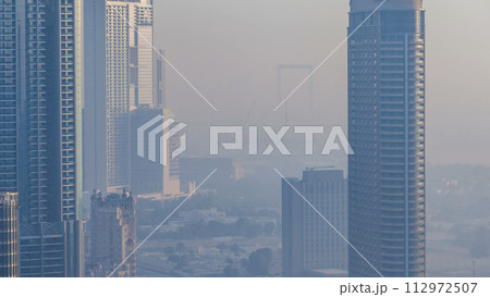 Foggy morning in downtown of Dubai timelapse. Foggy morning in downtown of Dubai timelapse. 112972507