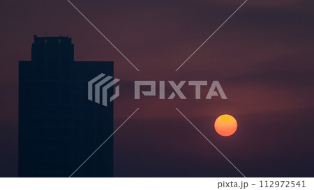 Foggy morning sunrise in downtown of Dubai timelapse. 112972541