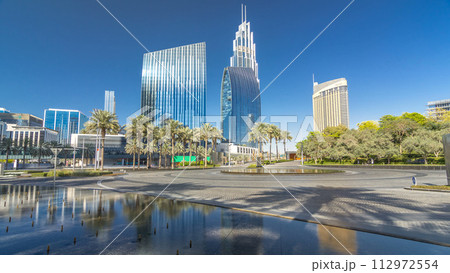Fountains near main entrance to the tallest skyscraper timelapse hyperlapse, Dubai 112972554