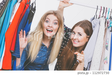 Happy women clothes shopping 112972730