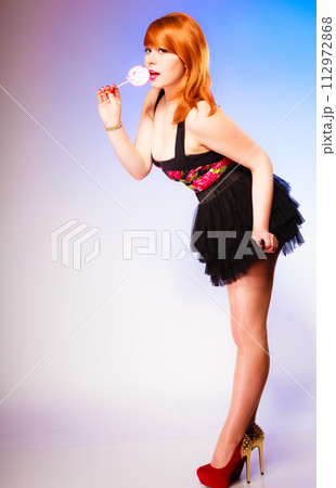 Young girl and sweet lollipop. Young girl and sweet lollipop. 112972868