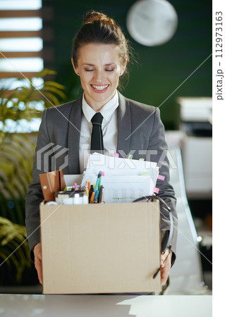 happy modern 40 years old woman worker in modern green office 112973163