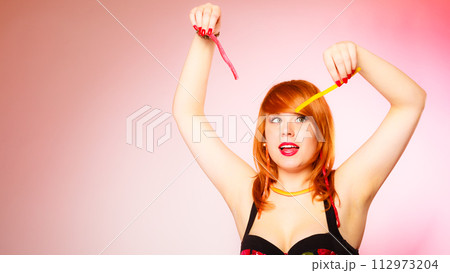 Woman with lot of sweets. 112973204