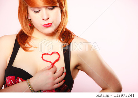 Girl holding valentine red heart love symbol. Valentines day. Girl holding valentine red heart love symbol. Valentines day. 112973241