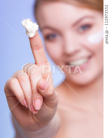 Skin care. Girl applying moisturizing cream. Skin care. Girl applying moisturizing cream. 112973552