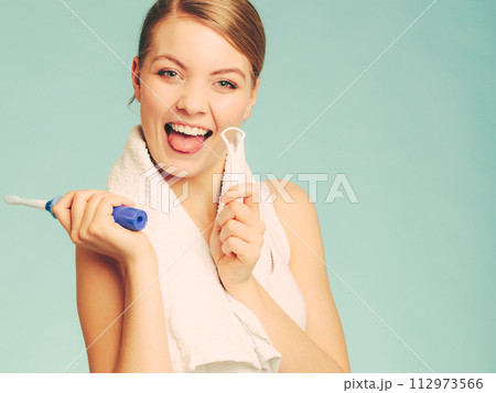 Girl with brush and tongue cleaner. 112973566