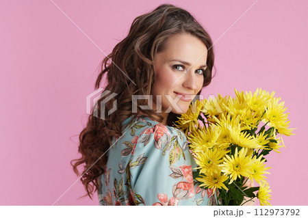 smiling elegant woman with long wavy brunette hair on pink smiling elegant woman with long wavy brunette hair on pink 112973792