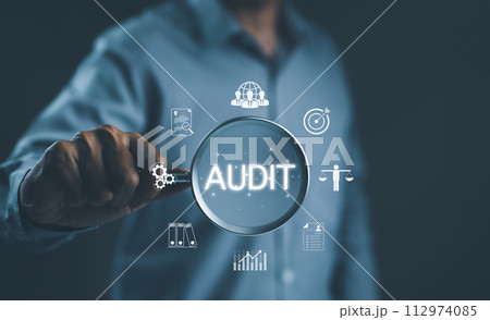 Audit business concept. Businessman holding magnifying glass with word "AUDIT" and business icons. Check to examine accounting and finance of business, Evaluation financial, standard certification, Audit business concept. Businessman holding magnifying glass with word "AUDIT" and business icons. Check to examine accounting and finance of business, Evaluation financial, standard certification, 112974085