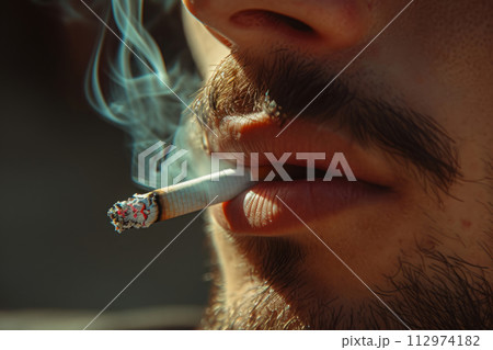 Close up young man smoking cigarette 112974182