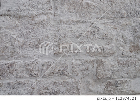 White rough stone wall background White rough stone wall background 112974521