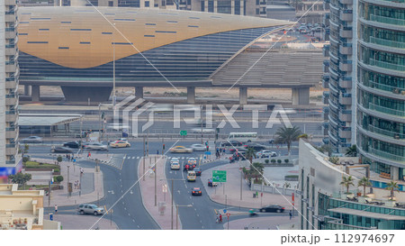 Beautiful aerial top view day to night transition timelapse of Dubai Marina canal Beautiful aerial top view day to night transition timelapse of Dubai Marina canal 112974697