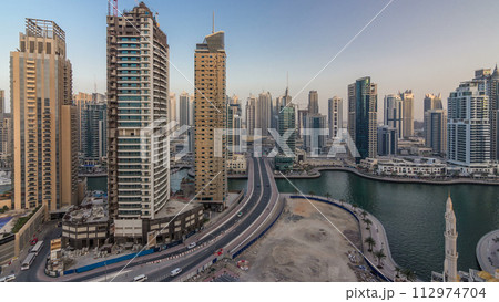 Beautiful aerial top view day to night transition timelapse of Dubai Marina canal 112974704