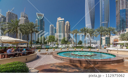 Panoramic view with modern skyscrapers and yachts of Dubai Marina timelapse hyperlapse, United Arab Emirates 112975062